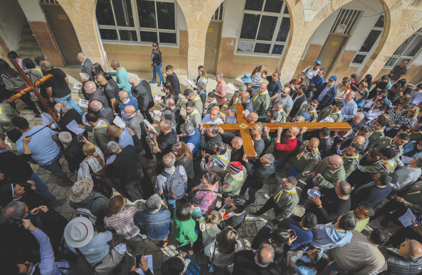  CHRISTIAN WORSHIPERS take part in a Good Friday procession in Jerusalem’s Old City. With the confluence of Passover, Easter and Ramadan this week, it is worthwhile pondering what our wishes should be. (photo credit: JAMAL AWAD/FLASH90)