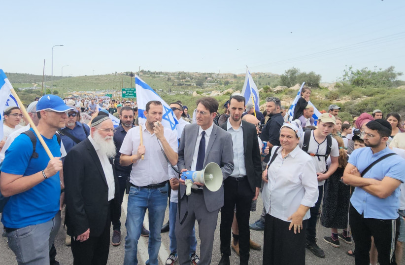  Israeli settlers, religious Zionists are seen on the march to Evyatar, on April 10, 2023. (photo credit: ROEE HADI)