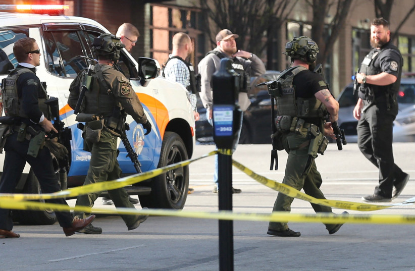  Police deploy at the scene of a mass shooting near Slugger Field baseball stadium in downtown Louisville, Kentucky, U.S. April, 10, 2023. (photo credit: Michael Clevenger/USA Today Network via REUTERS)