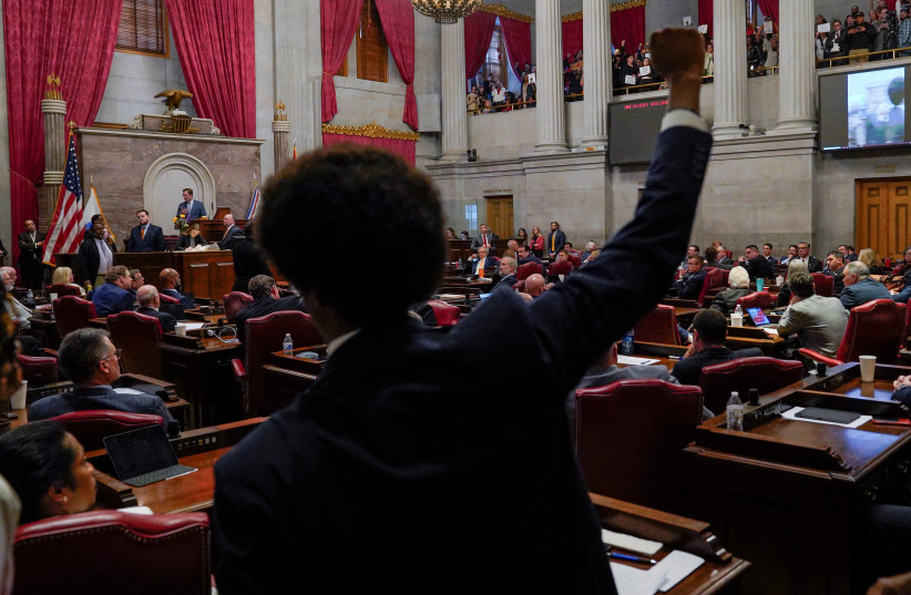  Rep. Justin Pearson raises his fist as a video of last week's gun control demonstration at the statehouse is screened and Republicans who control the Tennessee House of Representatives prepare to vote on whether to expel them for their role in it, in Nashville, Tennessee, U.S., April 6, 2023 (credit: REUTERS/Cheney Orr)