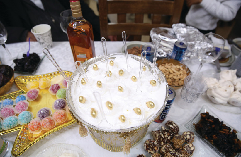 A PLETHORA of delicacies for a Mimouna celebration in Safed.  (photo credit: David Cohen/Flash90)