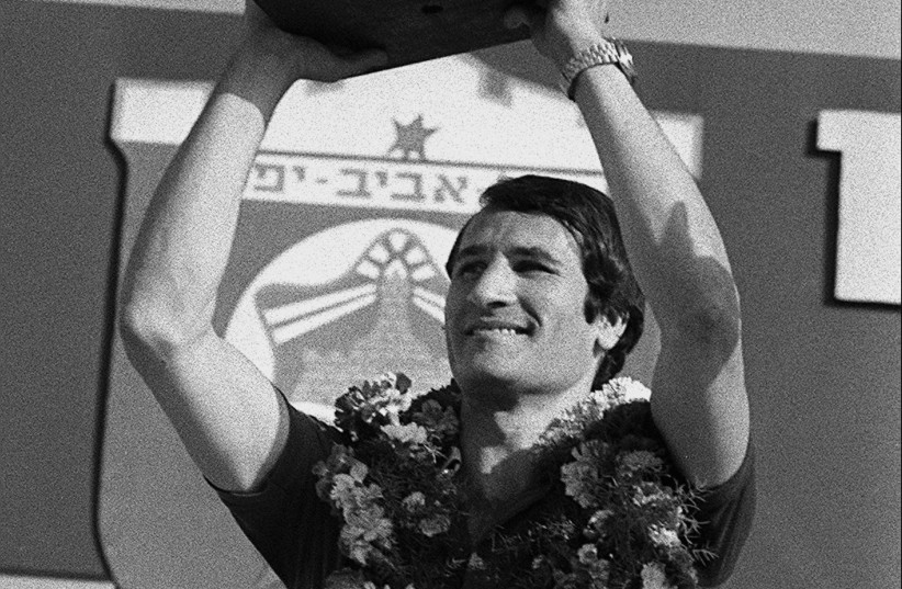  TAL BRODY holds aloft the basketball European Cup won by Maccabi Tel Aviv in Belgrade in 1977.  (credit: Yaakov Sa’ar/GPO)