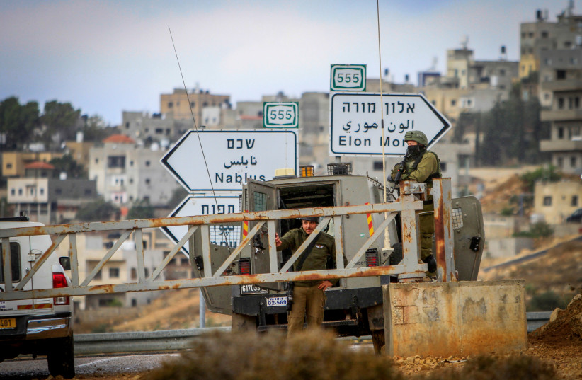  Israeli soldiers stand guard during a Palestinian protest near the Jewish settlement of Elon Moreh,east of Nablus, in the West Bank, November 25, 2022 (credit: NASSER ISHTAYEH/FLASH90)