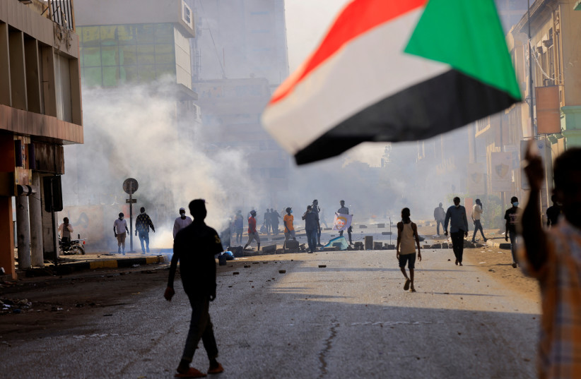  People march to the presidential palace, protesting against military rule following the coup in Khartoum, Sudan December 19, 2021 (photo credit: REUTERS/MOHAMED NURELDIN ABDALLAH)