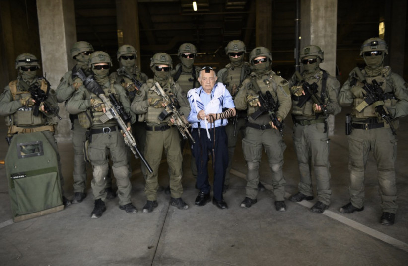  Jerusalem Border Police pose for a photo with their adopted Holocaust survivor, Ezekiel  (photo credit: ISRAEL POLICE SPOKESPERSON'S UNIT)