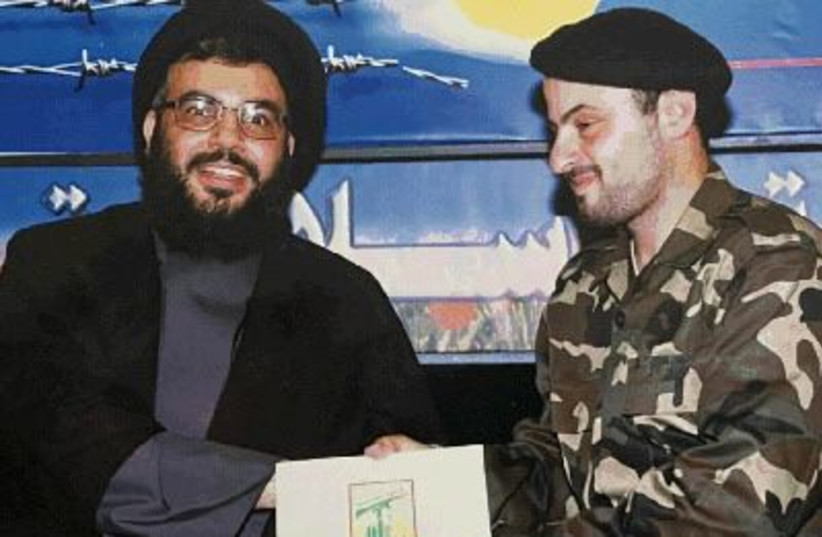  Haj Mahmed Radwan (right) seen with Hezbollah Secretary-General Hassan Nasrallah (left) (photo credit: SHIN BET)