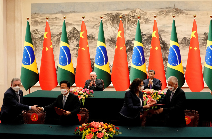  Chinese President Xi Jinping and Brazilian President Luiz Inacio Lula da Silva attend a signing ceremony at the Great Hall of the People in Beijing, China, April 14, 2023. (photo credit: Ken Ishii/Pool via Reuters)