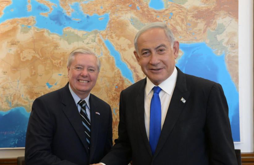  Israeli Prime Minister Benjamin Netanyahu is seen meeting with Republican South Carolina Sen. Lindsey Graham in Jerusalem, on April 17, 2023. (photo credit: AMOS BEN-GERSHOM/GPO)