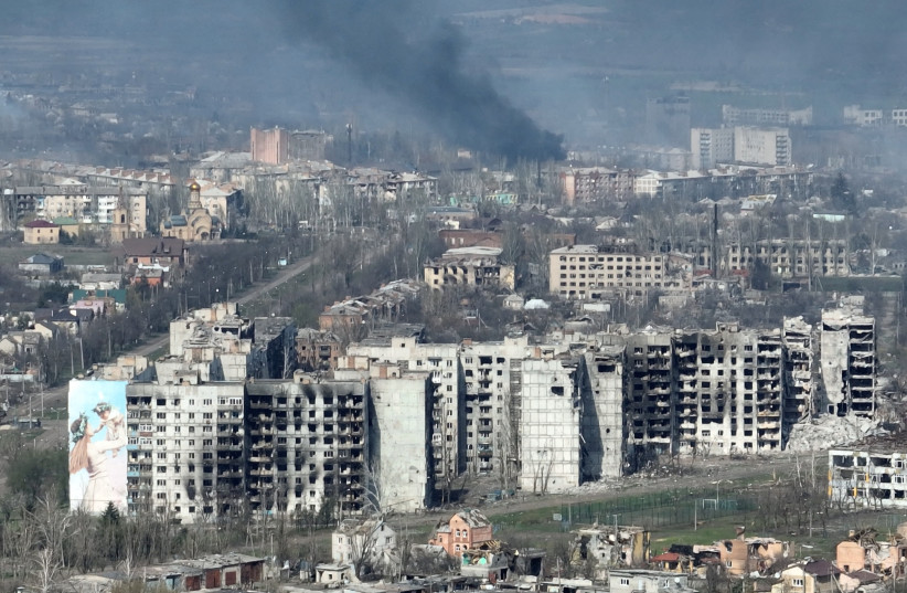  Smoke is seen in this drone footage of Bakhmut amid Russia's attack on Ukraine, in this screen grab obtained from a handout video released on April 15, 2023. (photo credit: Adam Tactic Group/Handout via REUTERS)