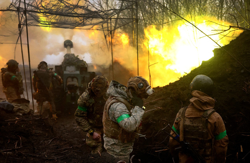  Ukrainian artillery fires towards the frontline during heavy fighting amid Russia's attack on Ukraine, near Bakhmut, Ukraine, April 13, 2023.  (photo credit: KAI PFAFFENBACH/REUTERS)