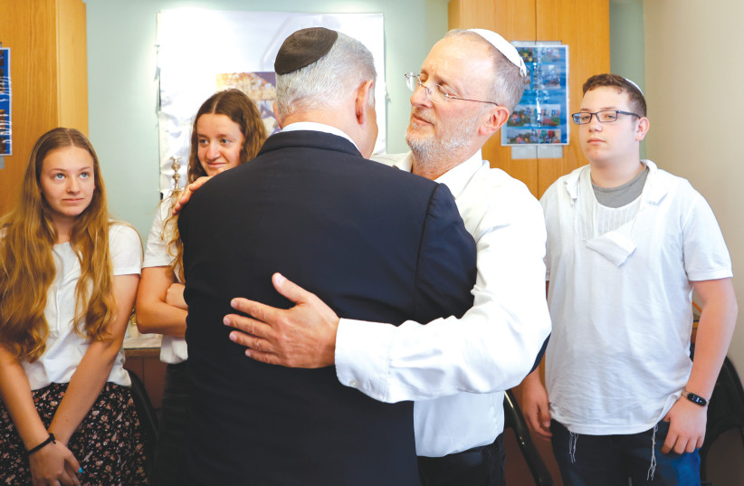  RABBI LEO Dee embraces Prime Minister Benjamin Netanyahu at the Dee family shiva at their home in Efrat, on Sunday.  (credit: GERSHON ELINSON/FLASH90)