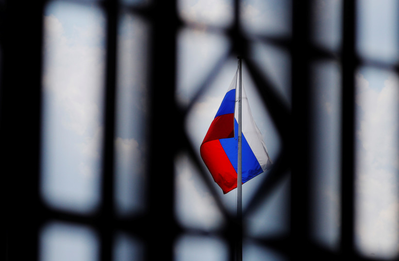  The Russian flag flies over the Embassy of Russia in Washington, US, August 6, 2018. (credit: BRIAN SNYDER/REUTERS)