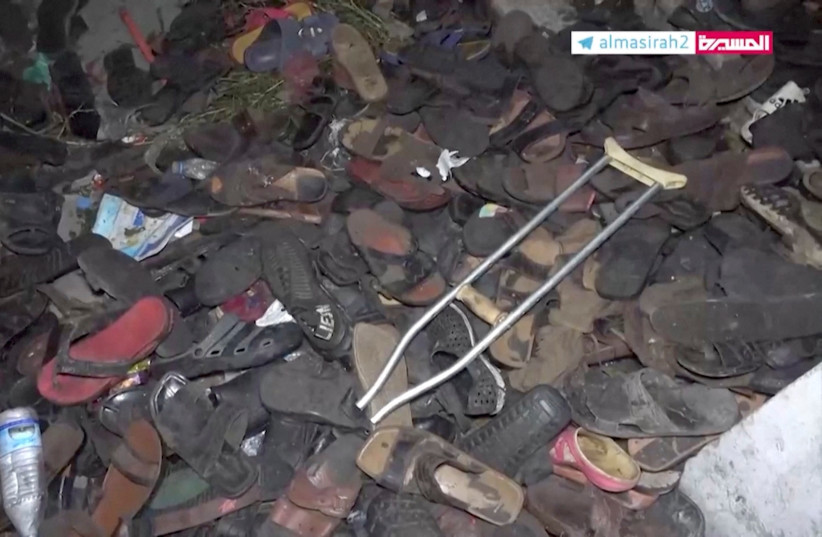  Abandoned footwear and other belongings lie on the ground after a stampede in Sanaa, Yemen, April 19, 2023, in this still image taken from video. (photo credit: Al Masirah TV/via Reuters TV/Handout via REUTERS)