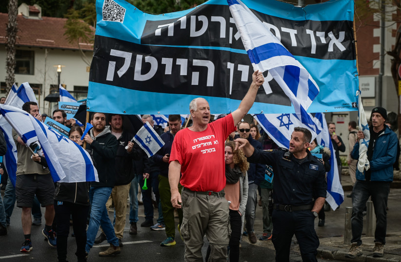 Workers from the high-tech sector and activists protest against the government's planned judicial overhaul, in Tel Aviv, on March 14, 2023 (photo credit: AVSHALOM SASSONI/FLASH90)