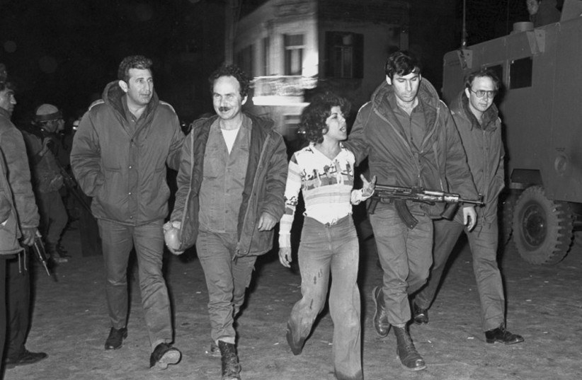  THE SAVOY Hotel Attack aftermath. Levi (third L), as she is escorted by Israeli security forces.  (photo credit: Wikimedia Commons)