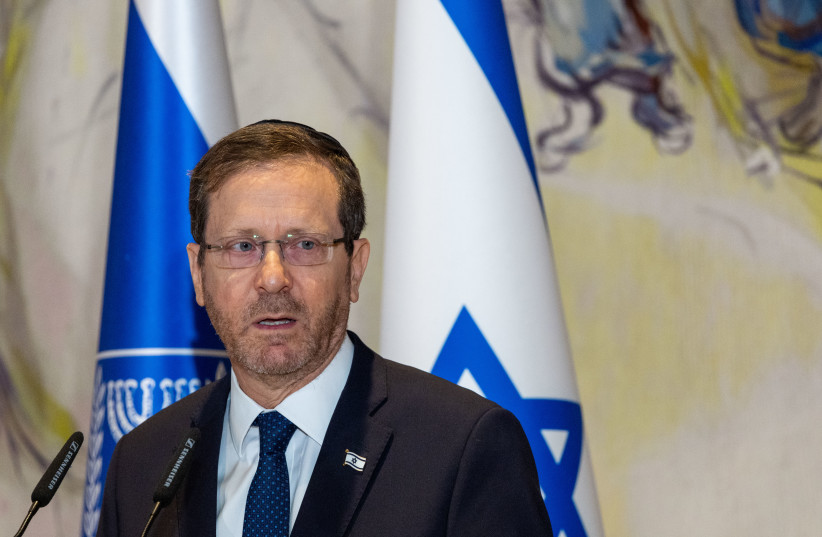 President Isaac Herzog speaks during a Holocaust memorial day ceremony held at the Knesset, Israel's Parliament in Jerusalem, April 18, 2023 (credit: YONATAN SINDEL/FLASH90)