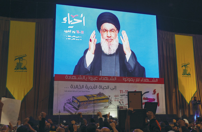  HEZBOLLAH LEADER Hassan Nasrallah addresses his supporters via video, marking Martyrs’ Day in Beirut’s southern suburbs, in November. Nasrallah is a great student of Israeli society and current events.  (credit: AZIZ TAHER/REUTERS)