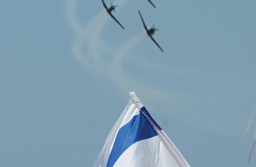 ISRAEL AIR FORCE pilots rehearse for the Independence Day flyover in the skies of Tel Aviv, earlier this week. (photo credit: AVSHALOM SASSONI/FLASH90)