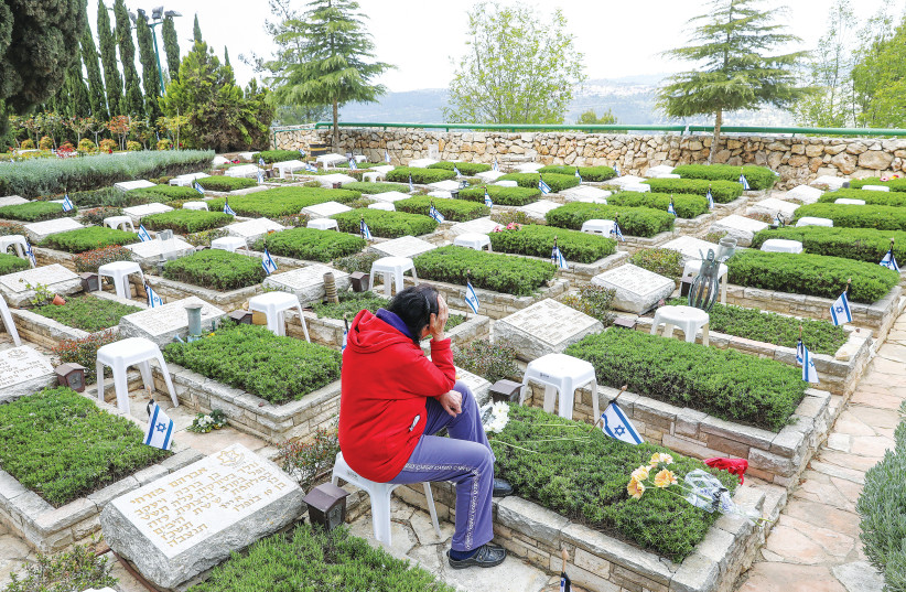  GRIEVING AT THE Mount Herzl Military Cemetery in Jerusalem last year. (credit: MARC ISRAEL SELLEM/THE JERUSALEM POST)