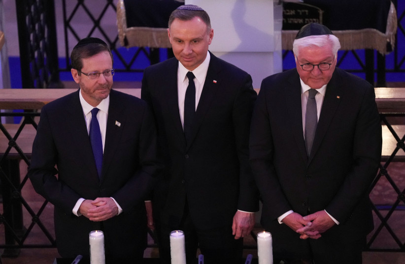  President Isaac Herzog, German President Frank-Walter Steinmeier and Polish President Andrzej Duda take part in the commemoration of the 80th anniversary of the Warsaw Ghetto Uprising, at the Nozyk Synagogue in Warsaw, Poland, April 19, 2023 (photo credit: REUTERS/ALEKSANDRA SZMIGIEL)