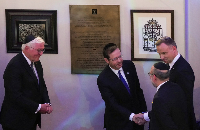  President Isaac Herzog, German President Frank-Walter Steinmeier and Polish President Andrzej Duda take part in the commemoration of the 80th anniversary of the Warsaw Ghetto Uprising, at the Nozyk Synagogue in Warsaw, Poland, April 19, 2023 (credit: REUTERS/ALEKSANDRA SZMIGIEL)