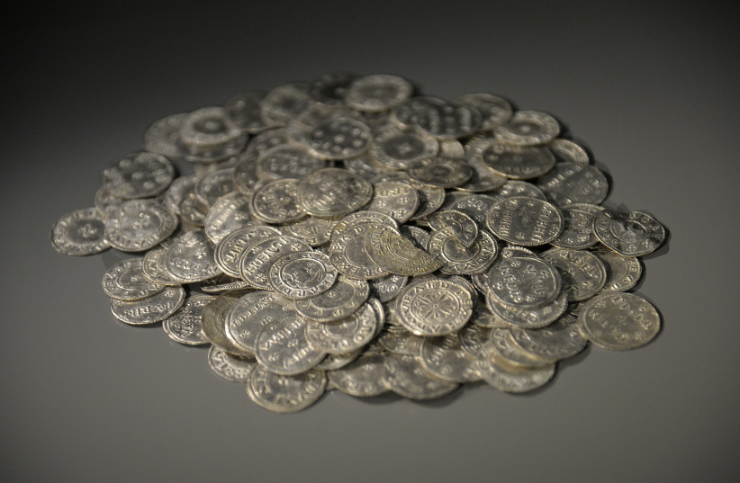 Anglo Saxon and Anglo Viking coins dating from the tenth century are displayed at the British Museum in London March 4, 2014. The coins are part of a major new exhibition 'Vikings: Life and Legend' which runs from March 6 to June 22 (credit: TOBY MELVILLE/REUTERS)
