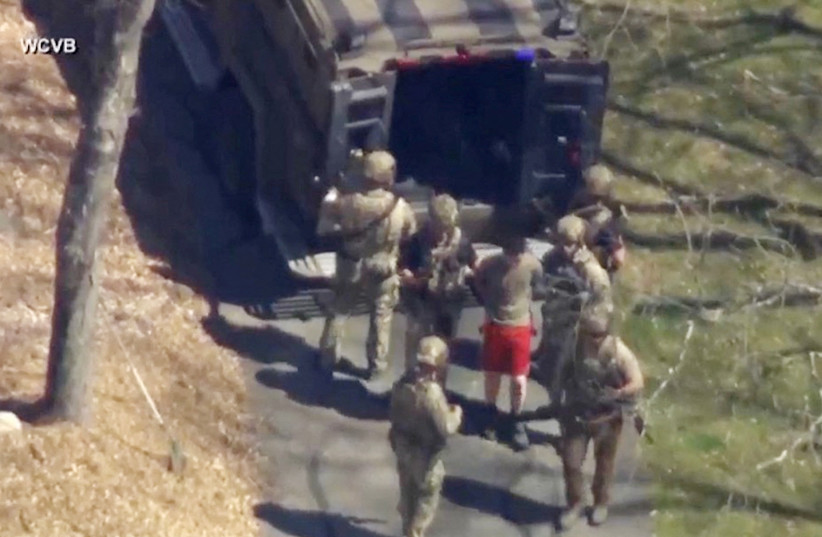  FBI agents arrest Jack Teixeira, an employee of the US Air Force National Guard, in connection with an investigation into the leaks online of classified U.S. documents, outside a residence in this still image taken from video in North Dighton, Massachusetts, US, April 13, 2023. (credit: WCVB-TV VIA ABC VIA REUTERS)