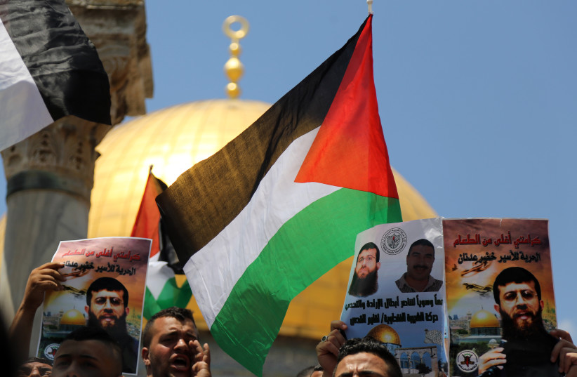  Protestors shout slogans during a demonstration in support of Palestinian Khader Adnan, a senior member of Islamic Jihad who is jailed in Israel, on June 5, 2015 (photo credit: SLIMAN KHADER/FLASH90)