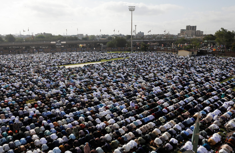  Muslims attend Eid al-Fitr prayers to mark the end of the fasting month of Ramadan, in Karachi, Pakistan April 22, 2023. (photo credit: REUTERS/AKHTAR SOOMRO)