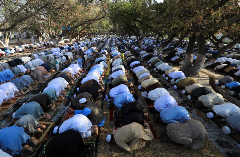  Muslims attend Eid al-Fitr prayers to mark the end of the fasting month of Ramadan in Peshawar, Pakistan April 22, 2023. (credit: REUTERS/FAYAZ AZIZ)