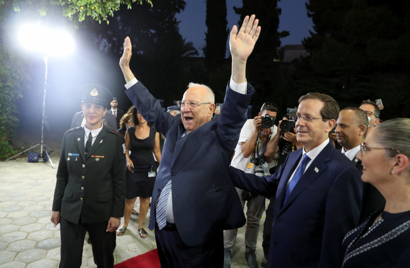  REUVEN RIVLIN with his successor, Isaac Herzog, at the President’s Residence on July 7, 2021. (credit: RONEN ZVULUN/REUTERS)
