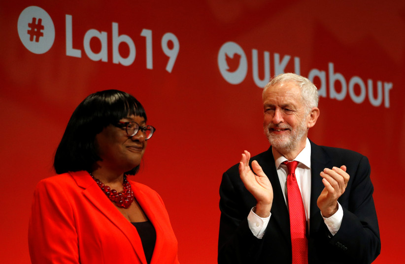  Britain's Labour party leader Jeremy Corbyn applauds after the speech of Labour party MP and Shadow Home Secretary Diane Abbott during the Labour Party annual conference in Brighton, Britain September 22, 2019. (credit: PETER NICHOLLS/REUTERS)