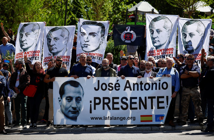  Supporters of the founder of Spanish fascist Falange party, Jose Antonio Primo de Rivera, wait to pay tribute outside the San Isidro cemetery, where his remains exhumed from the Franco-era monument known as ''The Valley of the Fallen'' were transferred, in Madrid, Spain, April 24, 2023.  (credit: Juan Medina/Reuters)