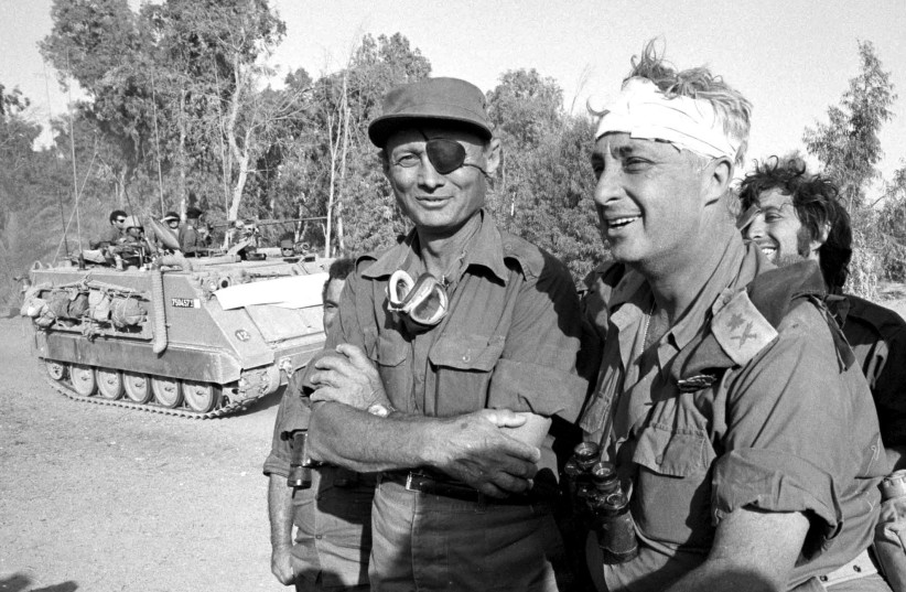  THEN-DEFENSE minister Moshe Dayan surveys the western side of the Suez Canal with Maj.-Gen. Ariel Sharon, in October 1973. When Egypt and Syria surprised Israel on Yom Kippur, Dayan feared destruction.  (credit: DEFENSE MINISTRY)