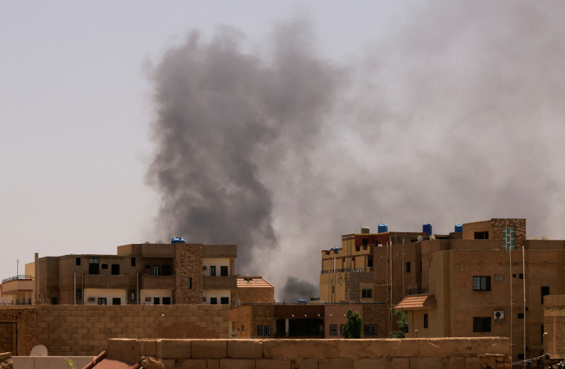  Smoke is seen rise from buildings during clashes between the paramilitary Rapid Support Forces and the army in Khartoum North, Sudan. April 22, 2023. (photo credit: MOHAMED NURELDIN ABDALLAH/REUTERS)