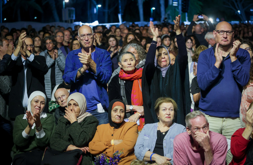  Palestinians and Israelis attend a joint ceremony for families of Israeli and Palestinian victims on Israeli Memorial Day, organized by "Combatants for Peace" and the "Israeli-Palestinian Bereaved Families for Peace" in Tel Aviv on April 24, 2023. (photo credit: ITAI RON/FLASH90)