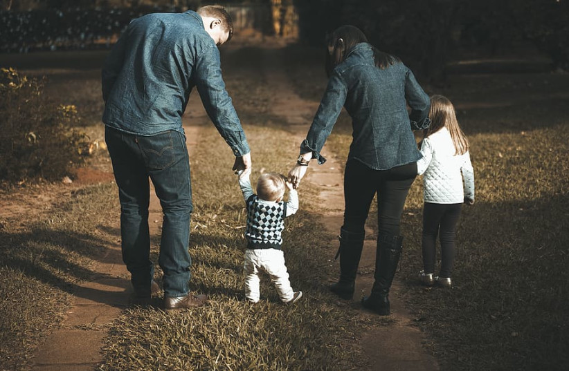  Family holding hands and walking together (credit: WALLPAPER FLARE)