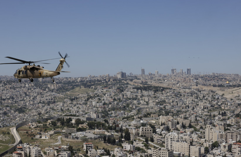  A helicopter flies over Jerusalem as part of Israel's Independence Day airshow, April 26, 2023.  (credit: MARC ISRAEL SELLEM/THE JERUSALEM POST)