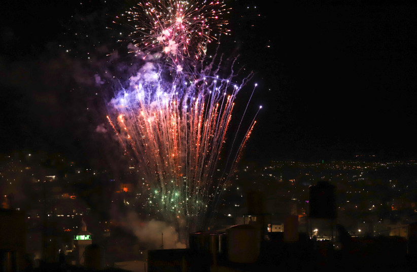  Fireworks in the West Bank city of Hebron, during independence day celebrations, April 25, 2023.  (credit: WISAM HASHLAMOUN/FLASH90)