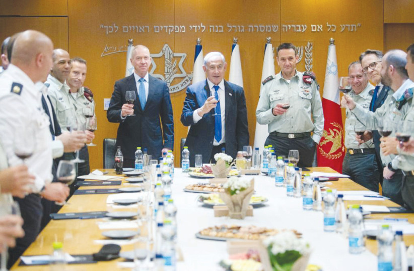  Prime Minister Benjamin Netanyahu with Defense Minister Yoav Gallant and IDF Chief of General Staff Lt.-Gen. Herzi Halevi at a toast with the IDF General Staff Forum on April 4. (photo credit: KOBI GIDEON/GPO)