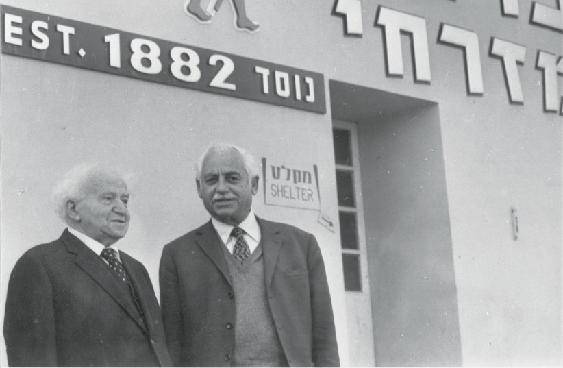  ELYAKUM OSTHASHINSKI, legendary CEO of Carmel Mizrahi, with David Ben-Gurion at Rishon Le Zion Cellars, where Israel’s first prime minister once worked.  (photo credit: Carmel)
