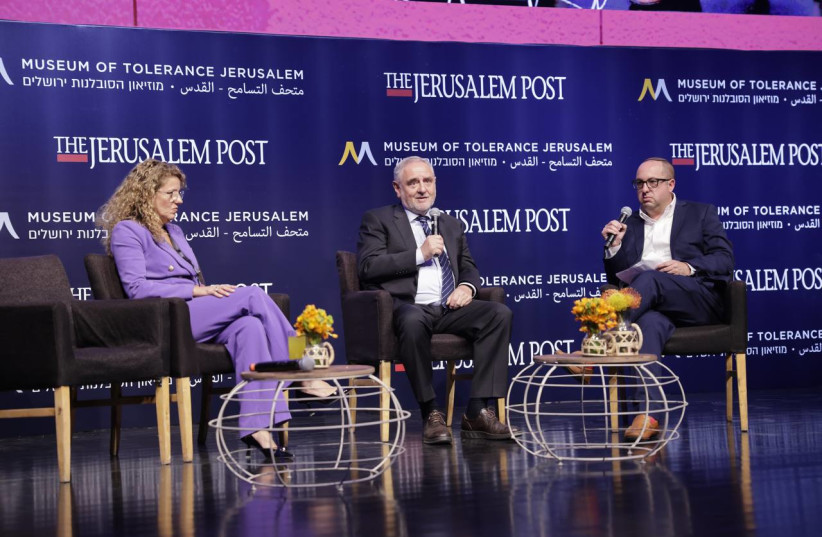  Sonia Gomes de Mesquita and Robert Singer are seen being interviewed by Zvika Klein at The Jerusalem Post's Celebrate the Faces of Israel 2023 conference at the Museum of Tolerance Jerusalem, on April 27, 2023. (photo credit: MARC ISRAEL SELLEM/THE JERUSALEM POST)