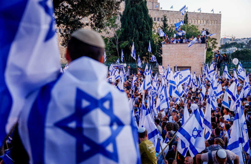 Right-wing Israelis attend a rally in support of the government's planned judicial overhaul, outside the Knesset, the Israeli parliament in Jerusalem, on April 27, 2023. (photo credit: ERIK MARMOR/FLASH90)