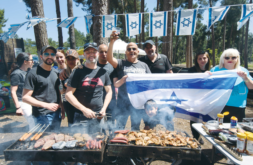 CELEBRATING INDEPENDENCE Day, on Wednesday, with the traditional barbecue: We should offer thanks for a fledgling state that, in just three-quarters of a century, made possible what seemed impossible. (photo credit: AYAL MARGOLIN/FLASH90)