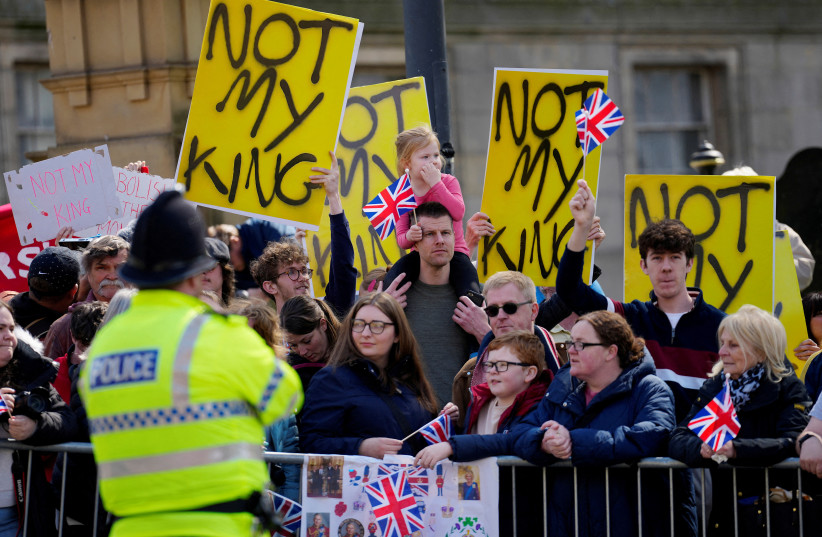  Protestors ahead of the coronation. (photo credit: REUTERS)