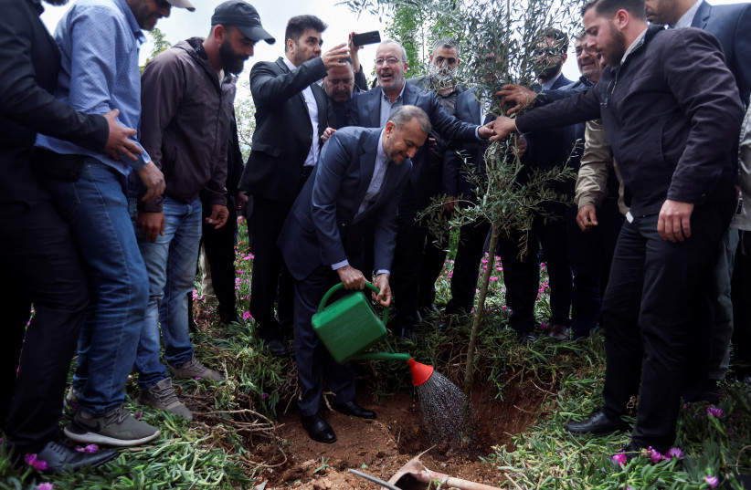  Iranian Foreign Minister Hossein Amirabdollahian, waters a tree, during his visit to Maroun Al-Ras village near the border between Lebanon and Israel, Lebanon April 28, 2023. (credit: REUTERS/AZIZ TAHER)