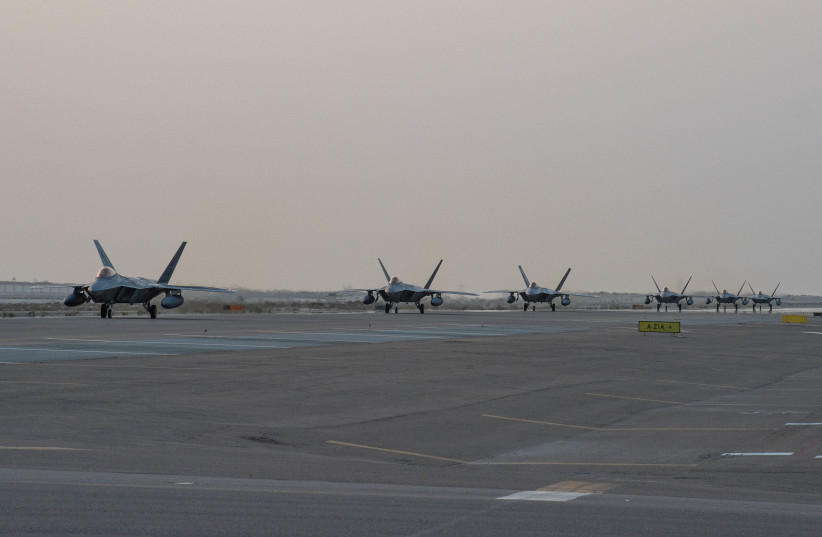  U.S. Air Force F-22 Raptors arrive at Al Dhafra Air Base, Abu Dhabi, United Arab Emirates, in this photo taken on February 12, 2022 and released by the U.S. Air Force on February 12, 2022. (photo credit: U.S. Air Force Central Command/Sgt. Chelsea E. FitzPatrick/Handout via REUTERS)