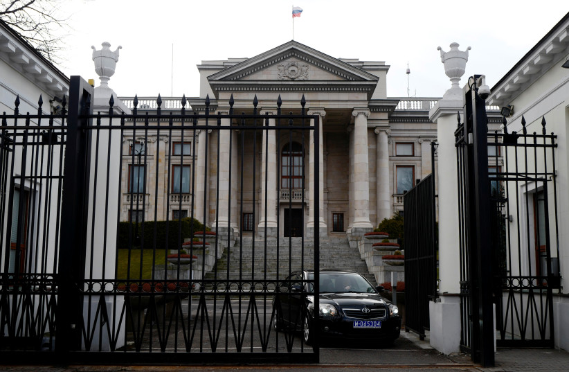  A car leaves through the gate of the Russian embassy building in Warsaw, Poland March 26, 2018. (photo credit: REUTERS/KACPER PEMPEL)