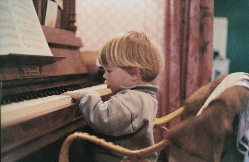  Child playing piano (illustrative). (photo credit: Wikimedia Commons)