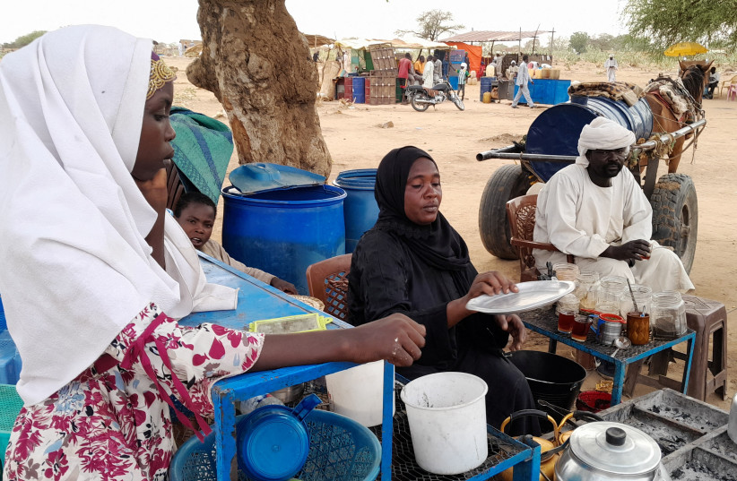 Fatma Dahab Ousmane, a Sudanese refugee who fled the violence in her country, sells tea and porridge to the other refugees near the border between Sudan and Chad, in Koufroun, Chad May 1, 2023. (credit: REUTERS/Mahamat Ramadane)